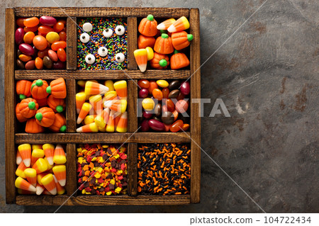 Halloween candy and sprinkles in wooden box 104722434