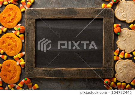 Halloween pumpkin cookies and candy 104722445