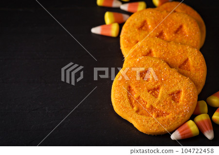 Halloween pumpkin cookies and candy 104722458