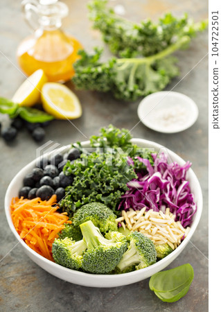 Making detox superfood salad 104722501