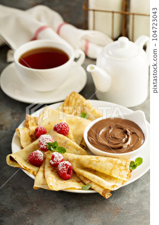 Crepes with raspberry and chocolate sauce Crepes with raspberry and chocolate sauce 104723043