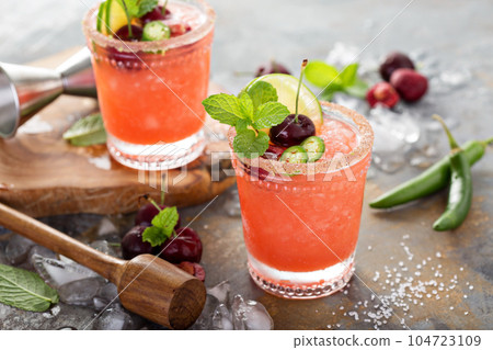 Refreshing summer cocktail with cherry Refreshing summer cocktail with cherry 104723109