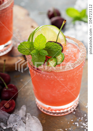 Refreshing summer cocktail with cherry 104723112