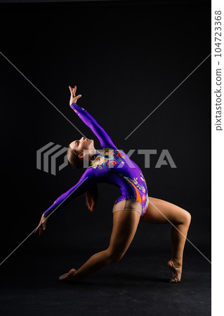 Fashion girl ballet dancer. Sport gymnastics studio shot on white and black background 104723368