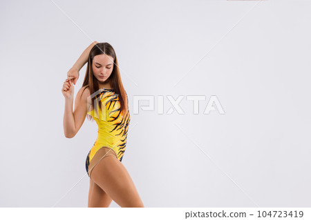 Fashion girl ballet dancer. Sport gymnastics studio shot on white and black background 104723419