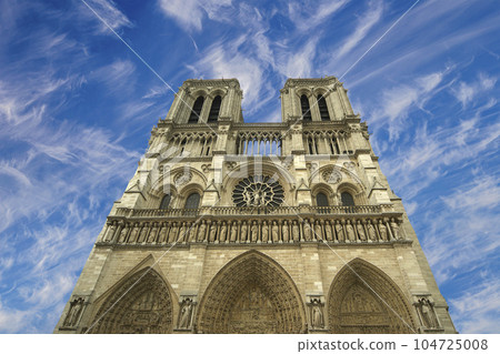 Notre Dame de Paris (against the background of sky with clouds), also known as Notre Dame Cathedral or simply Notre Dame, is a Gothic, Roman Catholic cathedral of Paris, France 104725008