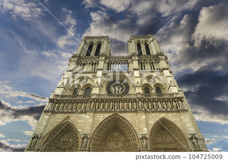 Notre Dame de Paris (against the background of sky with clouds), also known as Notre Dame Cathedral or simply Notre Dame, is a Gothic, Roman Catholic cathedral of Paris, France 104725009