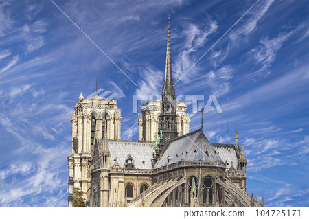 Notre Dame de Paris (against the background of sky with clouds), also known as Notre Dame Cathedral or simply Notre Dame, is a Gothic, Roman Catholic cathedral of Paris, France Notre Dame de Paris (against the background of sky with clouds), also known as Notre Dame Cathedral or simply Notre Dame, is a Gothic, Roman Catholic cathedral of Paris, France 104725171
