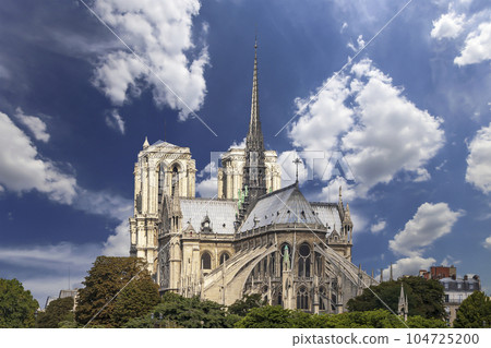 Notre Dame de Paris (against the background of sky with clouds), also known as Notre Dame Cathedral or simply Notre Dame, is a Gothic, Roman Catholic cathedral of Paris, France Notre Dame de Paris (against the background of sky with clouds), also known as Notre Dame Cathedral or simply Notre Dame, is a Gothic, Roman Catholic cathedral of Paris, France 104725200