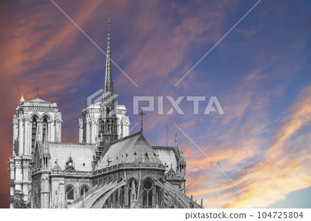 Notre Dame de Paris (against the background of a sky at sunset), also known as Notre Dame Cathedral or simply Notre Dame, is a Gothic, Roman Catholic cathedral of Paris, France Notre Dame de Paris (against the background of a sky at sunset), also known as Notre Dame Cathedral or simply Notre Dame, is a Gothic, Roman Catholic cathedral of Paris, France 104725804