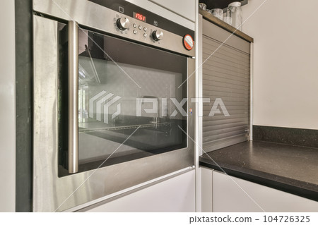 a kitchen with an oven and counter space for the stoves to be used in this home appliance a kitchen with an oven and counter space for the stoves to be used in this home appliance 104726325