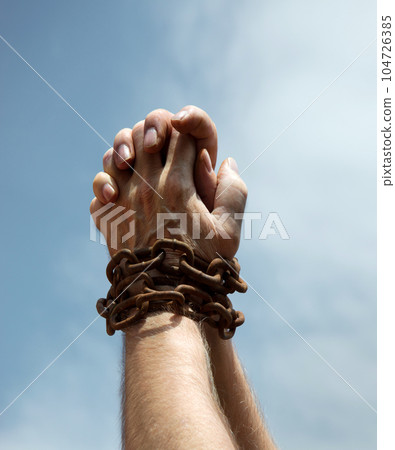 Chained hands praying for help Chained hands praying for help 104726385