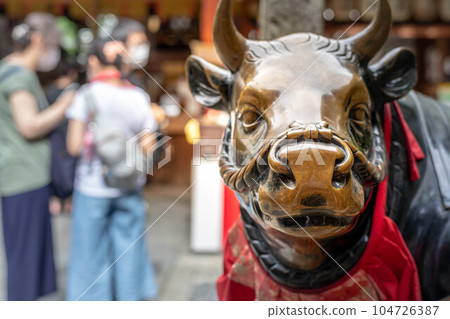 Bustling Nishiki Tenmangu Shrine and Shinto Buffalo Statues in early summer in Nishiki Koji, Kyoto Bustling Nishiki Tenmangu Shrine and Shinto Buffalo Statues in early summer in Nishiki Koji, Kyoto 104726387