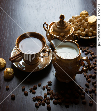 Fragrant coffee with sweets on the table Fragrant coffee with sweets on the table 104726511