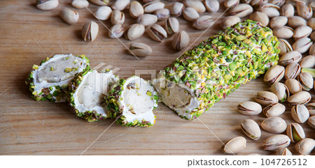 Nuts and halva on the table 104726512