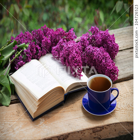 Still life from ancient book and lush boquet Still life from ancient book and lush boquet 104726523