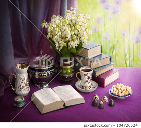 Still life from ancient book and lush boquet Still life from ancient book and lush boquet 104726524