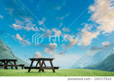 Wooden Tables And Benches In Mountains Summer Landscape. altered calm blue sky above valley Wooden Tables And Benches In Mountains Summer Landscape. altered calm blue sky above valley 104727628