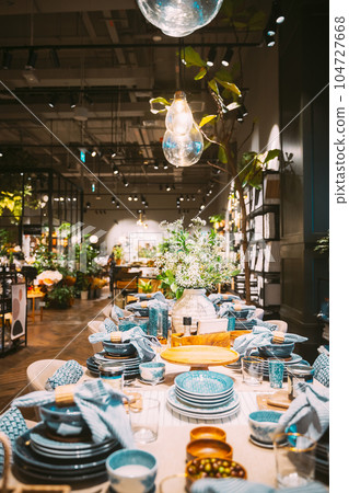 View of assortment of decor for interior shop in store of shopping center. Home accessories and household products for dining room in store of shopping centre. View of beautifully set table. Home 104727668