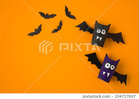 DIY flat layout of toys made by children, Halloween decorations on a red background. Space for text. DIY flat layout of toys made by children, Halloween decorations on a red background. Space for text. 104727697