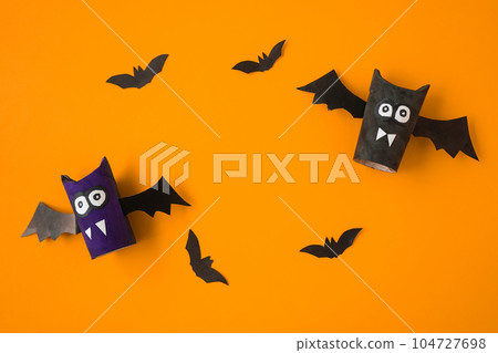 DIY flat layout of toys made by children, Halloween decorations on a red background. Space for text. DIY flat layout of toys made by children, Halloween decorations on a red background. Space for text. 104727698
