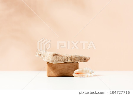 Natural background with wooden block, stone and seashell. Podium for cosmetics presentation 104727716
