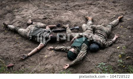 Wounded soldiers lie on the battlefield 104728522