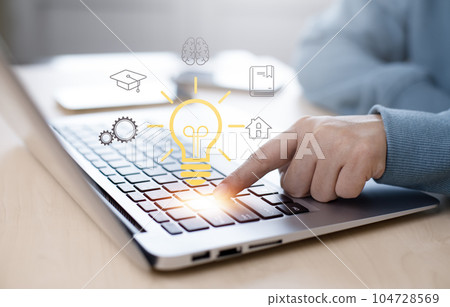 Hand using a Laptop with light bulb with line connect and working on the desk, Creativity and innovation are keys to success.Concept of new idea and innovation with energy and power , working at home, Hand using a Laptop with light bulb with line connect and working on the desk, Creativity and innovation are keys to success.Concept of new idea and innovation with energy and power , working at home, 104728569