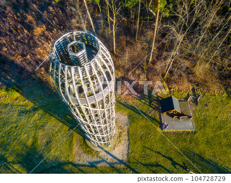 Wooden lookout tower in Hermanice on sunny spring day, Czech Republic. Aerial view from drone. Wooden lookout tower in Hermanice on sunny spring day, Czech Republic. Aerial view from drone. 104728729