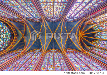 Monumental interior of Sainte-Chapelle with stained glass windows, upper level of royal chapel in the Gothic style. Palais de la Cite, Paris, France Monumental interior of Sainte-Chapelle with stained glass windows, upper level of royal chapel in the Gothic style. Palais de la Cite, Paris, France 104728731