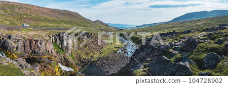 Panoramic view of Iceland at summer season with mountains and dramatic clouds Panoramic view of Iceland at summer season with mountains and dramatic clouds 104728902
