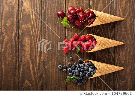 Fresh fruit and berries in waffle cones 104729661