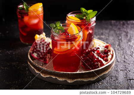 Pomegranate sangria with oranges 104729689