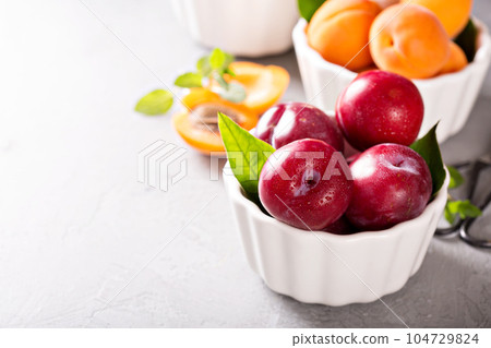 Various fruits in white bowls Various fruits in white bowls 104729824
