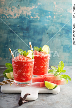 Watermelon slushie cocktail with lime 104729867