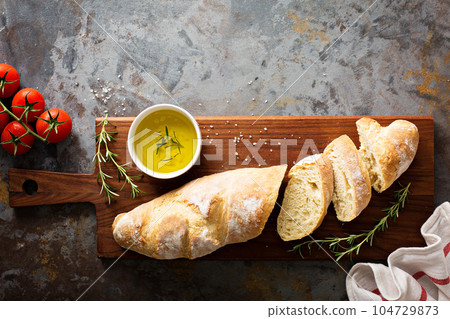 Homemade baguette with olive oil and salt 104729873