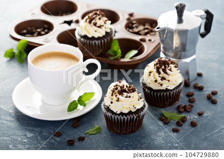 Chocolate cupcakes with vanilla frosting Chocolate cupcakes with vanilla frosting 104729880
