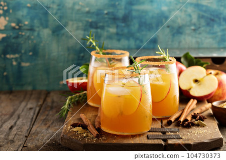 Hard apple cider cocktail with fall spices 104730373