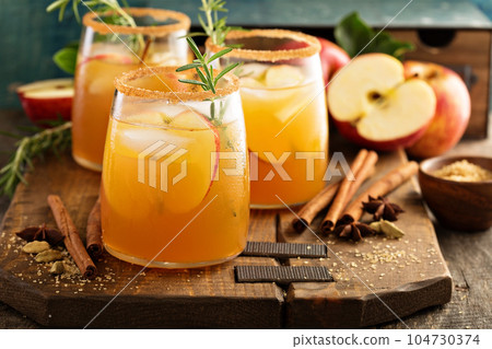 Hard apple cider cocktail with fall spices Hard apple cider cocktail with fall spices 104730374