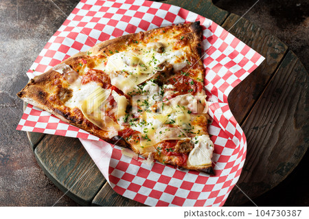 Big slice of pepperoni pizza Big slice of pepperoni pizza 104730387