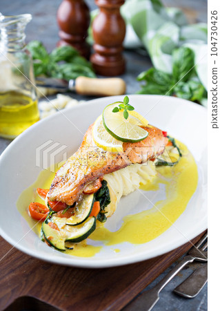 Salmon with vegetables and mashed potatoes Salmon with vegetables and mashed potatoes 104730426