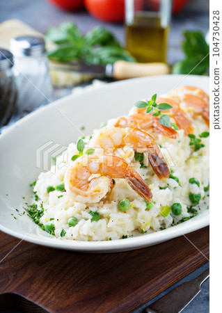 Green peas risotto with shrimp 104730428