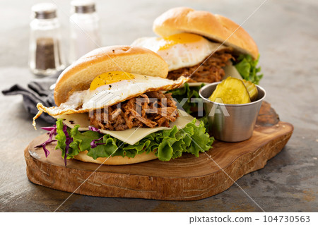 Pulled pork breakfast sandwiches with fried egg 104730563