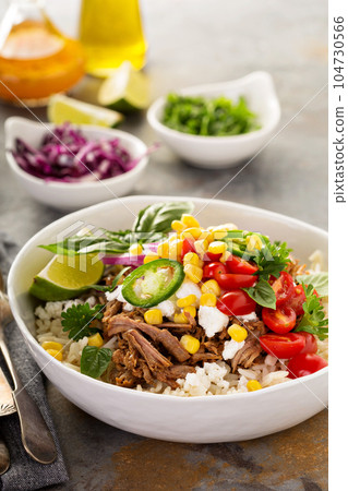 Dinner bowl with rice and pulled pork 104730566