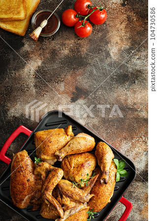 Grilled chicken in a pan 104730586