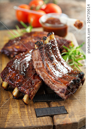 Grilled and smoked ribs with barbeque sauce Grilled and smoked ribs with barbeque sauce 104730614