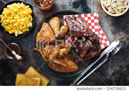 Grilled or smoked ribs and chicken 104730623