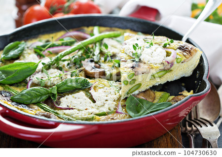 Asparagus, mushrooms and goat cheese frittata 104730630