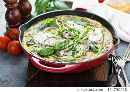 Asparagus, mushrooms and goat cheese frittata 104730638