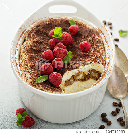Tiramisu cake in a ceramic dish Tiramisu cake in a ceramic dish 104730663